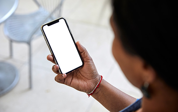 woman holding cell phone